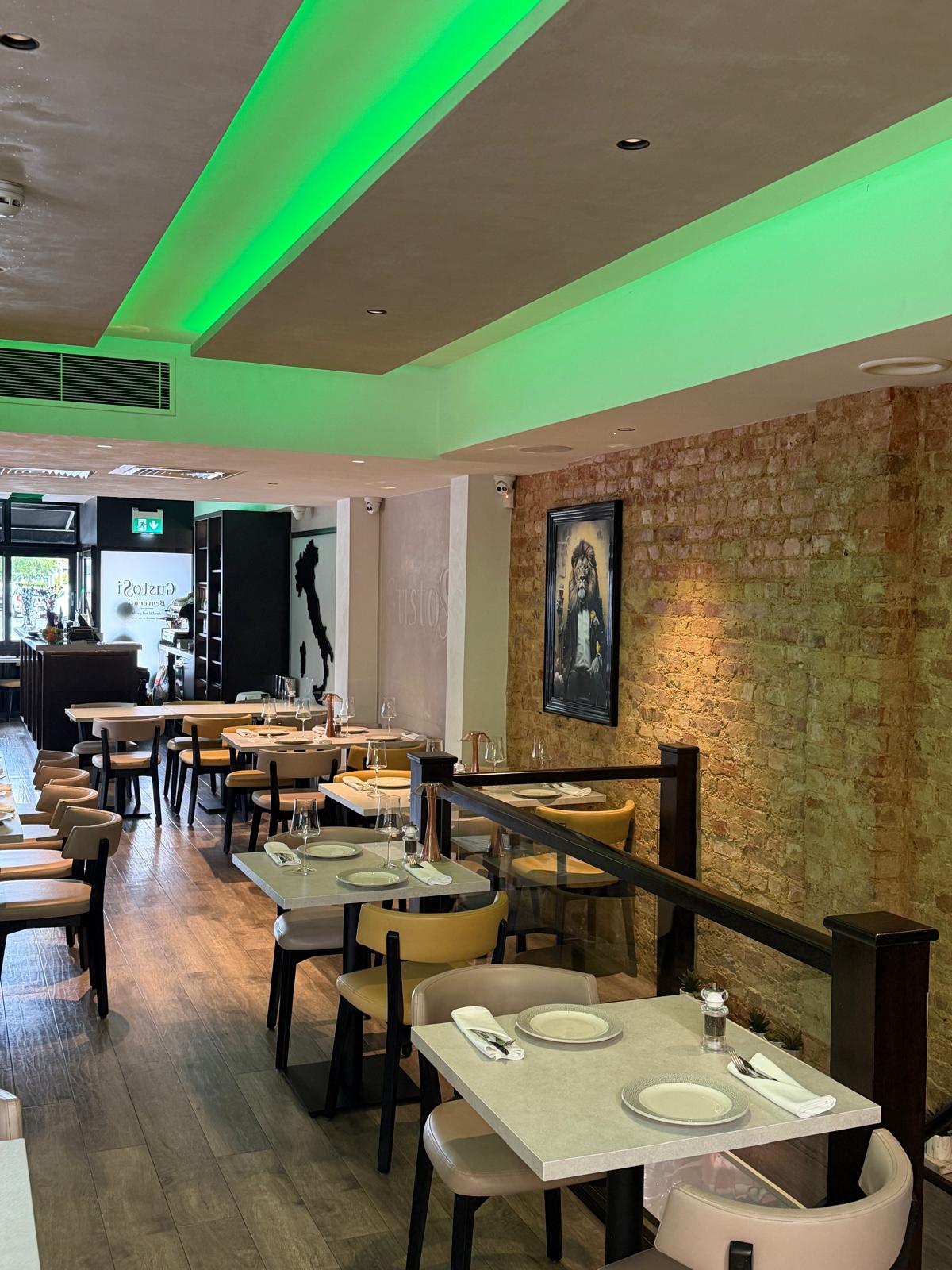 GustoSi dining room with green ambient lighting